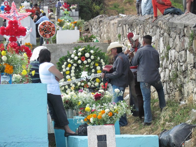 Families gather at the cemetery. Some play live music there, if the beloved relative asked for such celebration. In some parts of Mexico, people stay all night to spend special time with their ancestors.