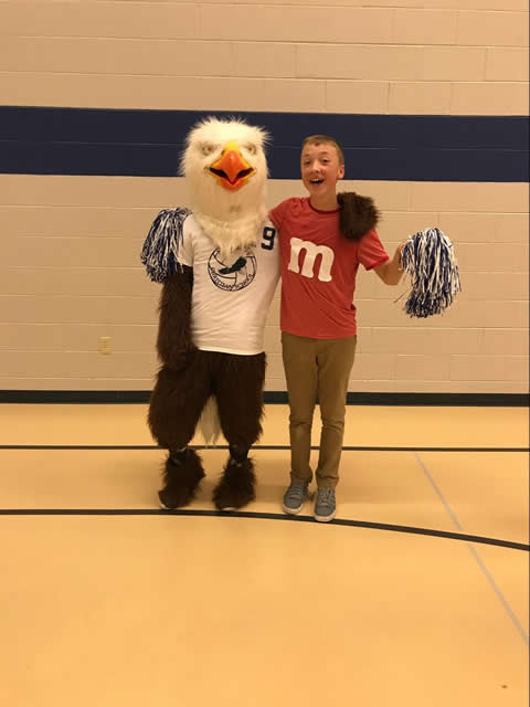 Mascot with student