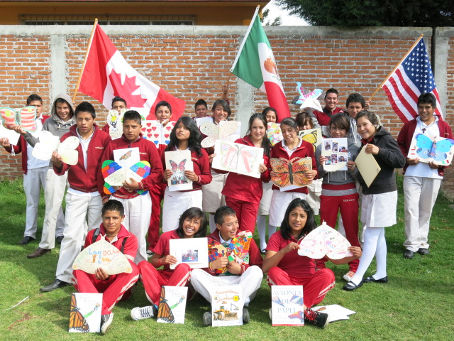 Photo of students in Mexico with Canada, US, and Mexico flags