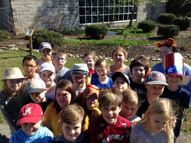 Students showing blooming garden.