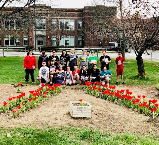 Students in Salem, New Hampshire in the blooming garden.