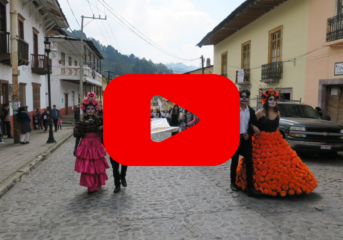 Dia de Muertos celebrations with a red play button over