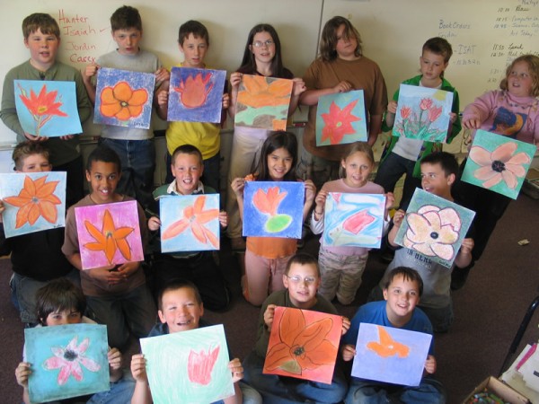 Photo of students and their flower art