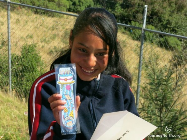 Photo of a student holding her gift