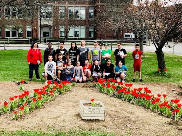 Students in Salem, New Hampshire in the blooming garden.