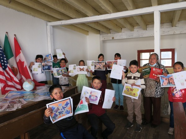 Students in Mexico holding Ambassador Monarchs.