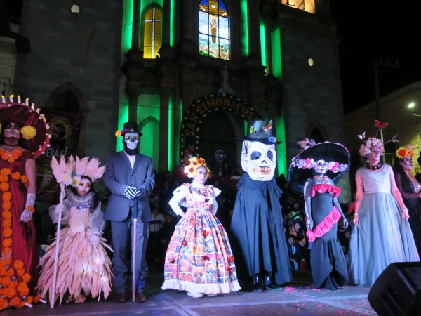 day of dead celebrations with people dressed in costumes 