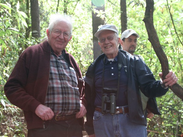 Dr. Lincoln Brower poses for a photo with former president Jimmy Carter in the forest in 2013