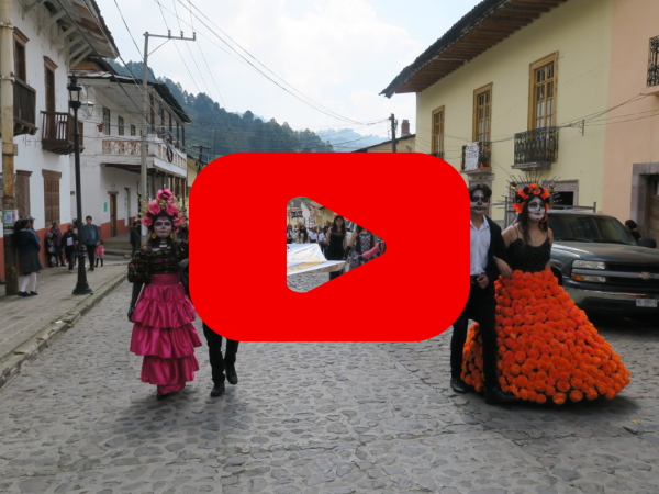 Dia de Muertos celebrations with a red play button over